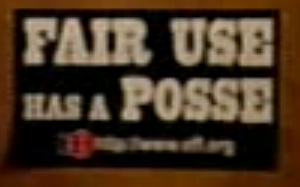 black sign with white text reading 'fair use has a posse'